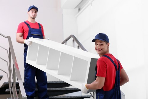 Removal team loading furniture and boxes for a house move