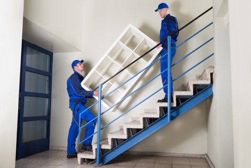 Professional movers handling apartment furniture in Cranford