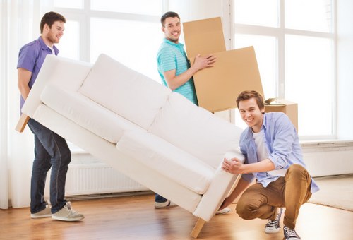 Packed moving boxes and furniture ready for transport in Cranford
