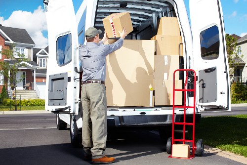 Packed boxes and furniture ready for a local house removal service