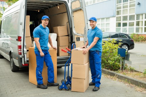 Packed boxes and furniture ready for local removal services